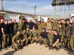 Group of Israeli Soldiers with building in the background
