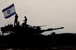 Two IDF soldiers standing on top of tank holding Israeli flag
